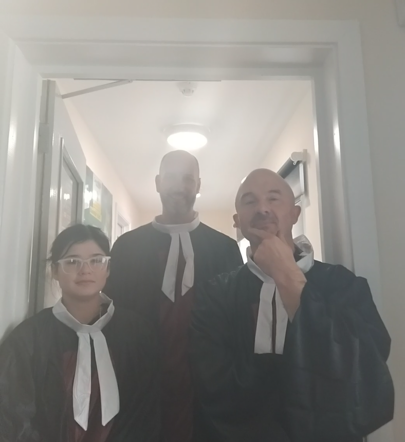 two members of staff and a student dressed up for parliament week.